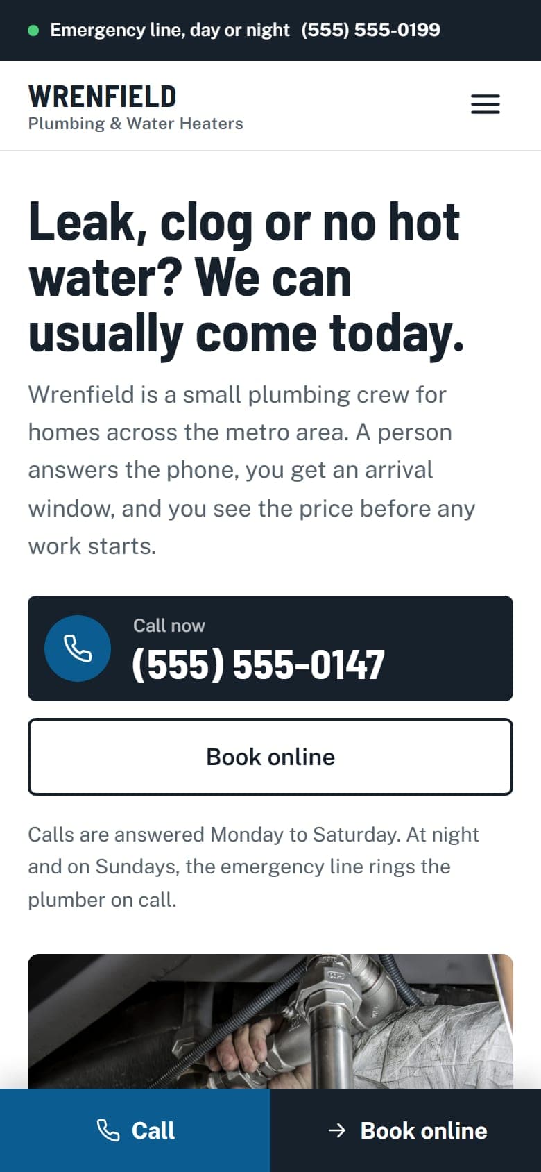 Home page of the Wrenfield Plumbing example site on a phone