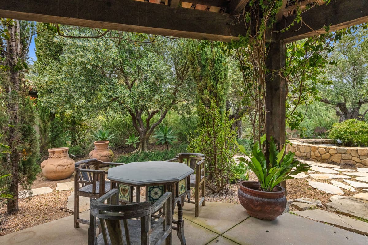 Seating under a vine pergola