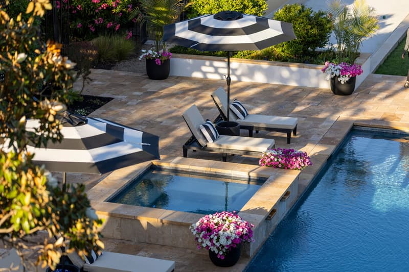 Paver deck around a pool and spa
